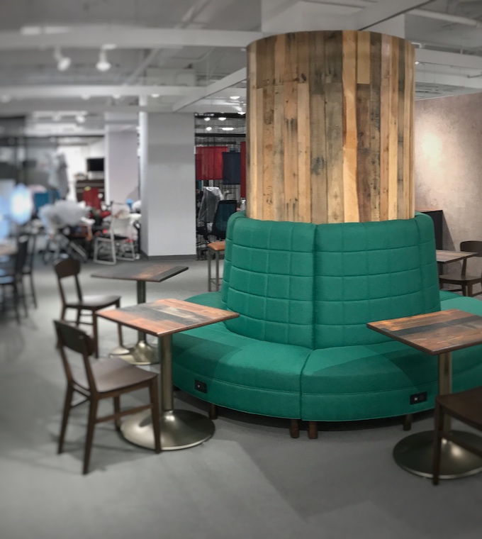 Pouf-style booth seating around a column