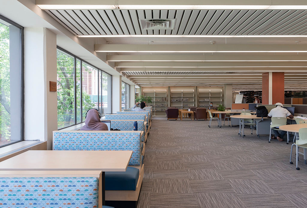 Laminate Frame Jupiter Booths, RightEdge laminate table tops with a PVC edge, and Classic Bases in Black