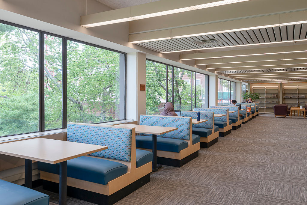 Laminate Frame Jupiter Booths, RightEdge laminate table tops with a PVC edge, and Classic Bases in Black