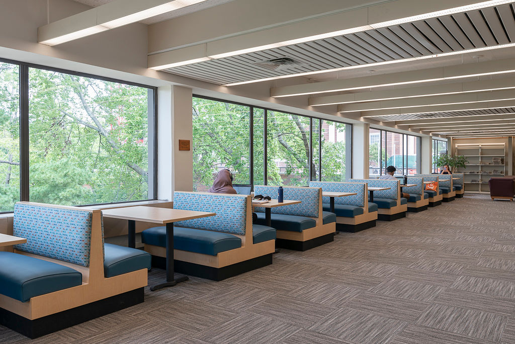 Laminate Frame Jupiter Booths, RightEdge laminate table tops with a PVC edge, and Classic Bases in Black