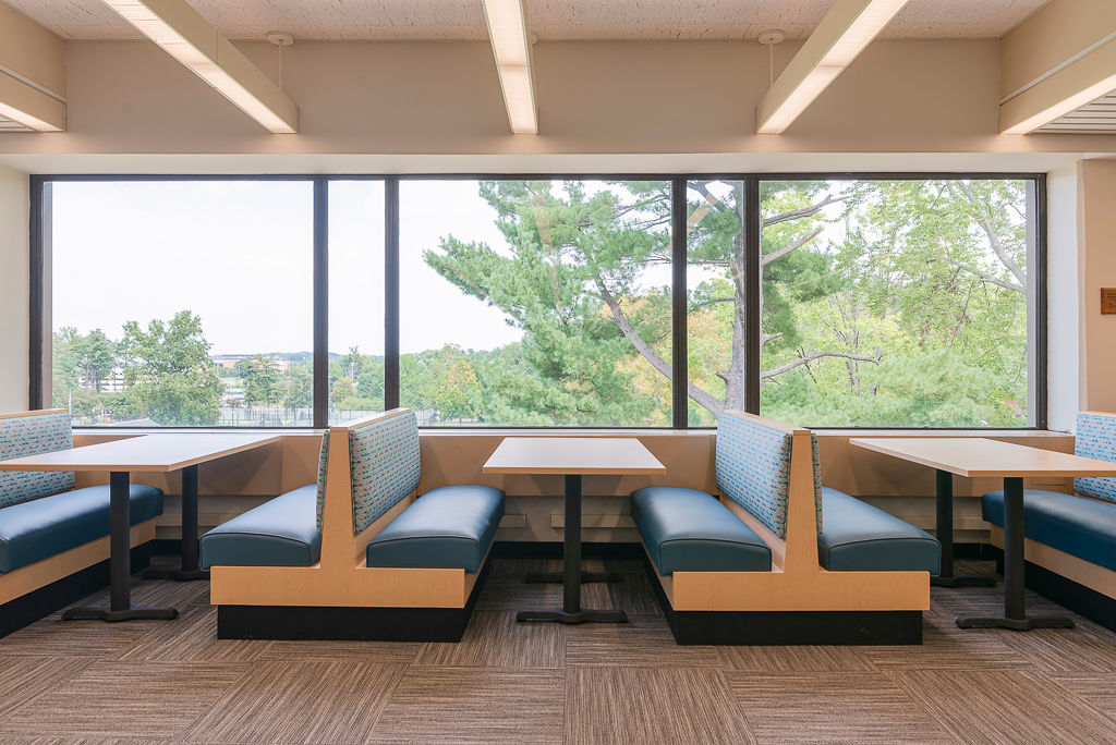 Laminate Frame Jupiter Booths, RightEdge laminate table tops with a PVC edge, and Classic Bases in Black
