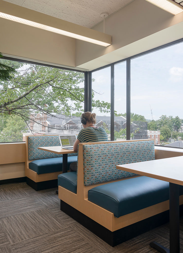 Laminate Frame Jupiter Booths, RightEdge laminate table tops with a PVC edge, and Classic Bases in Black